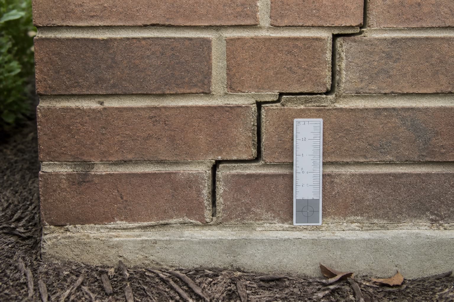 Foundation crack evaluation illustrating inspection-first repair planning in Wylie